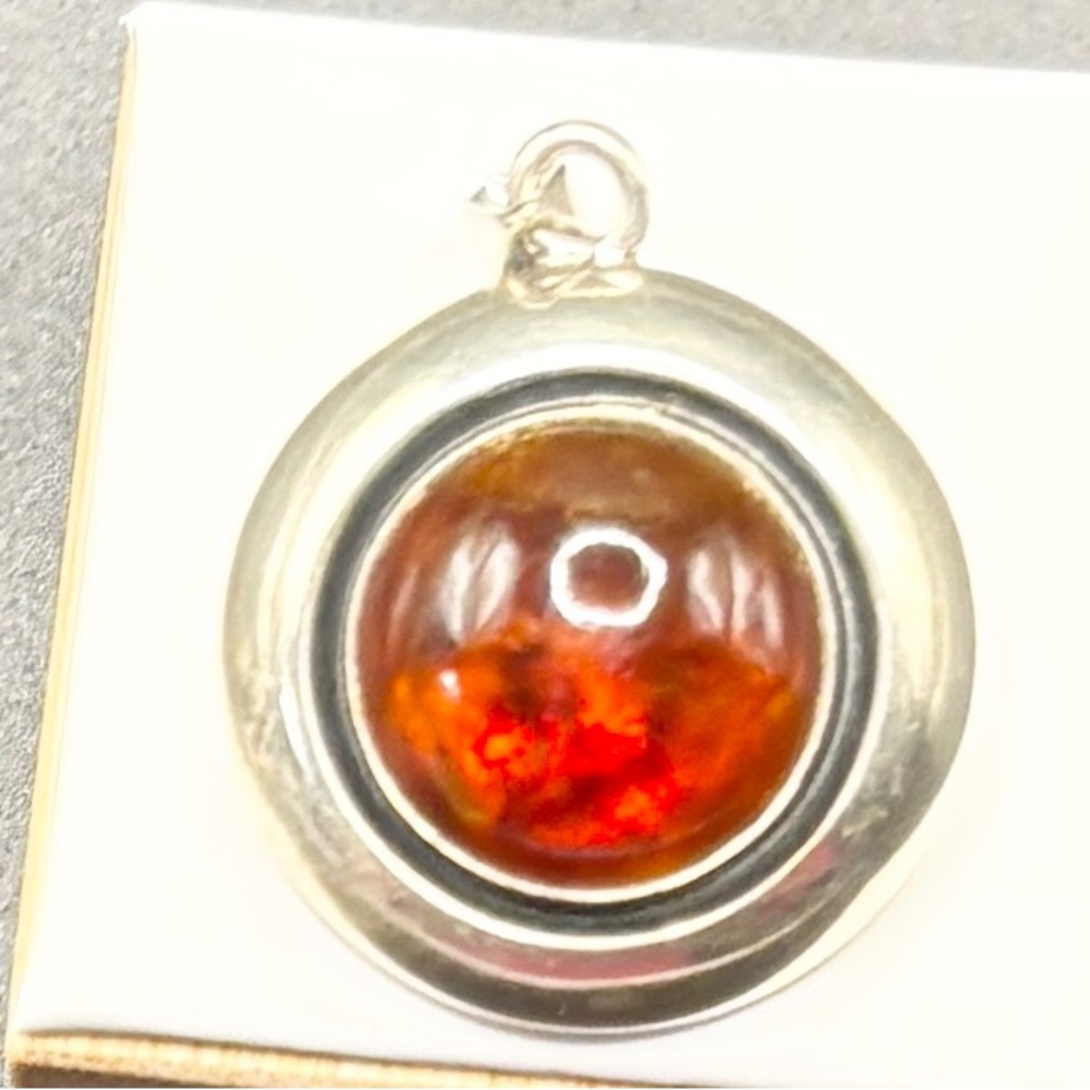 A Sterling Silver Round Pendent with a Lg Amber stone